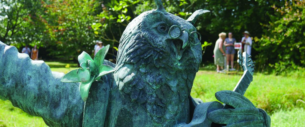 Close up of bronze statue of The Owl from 'The Owl and the Pussycat'