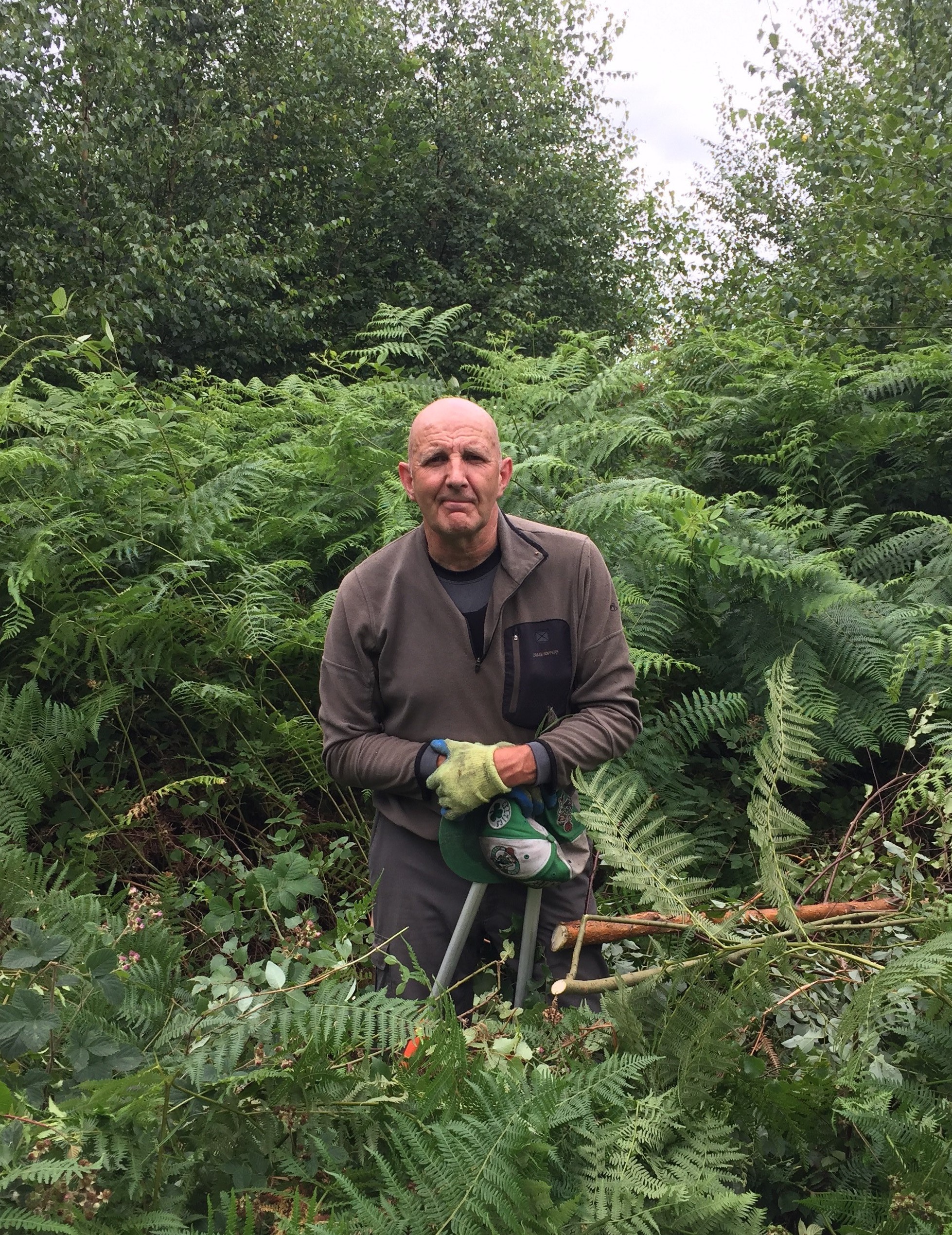 Volunteer Pete standing in the Forest holding loppers