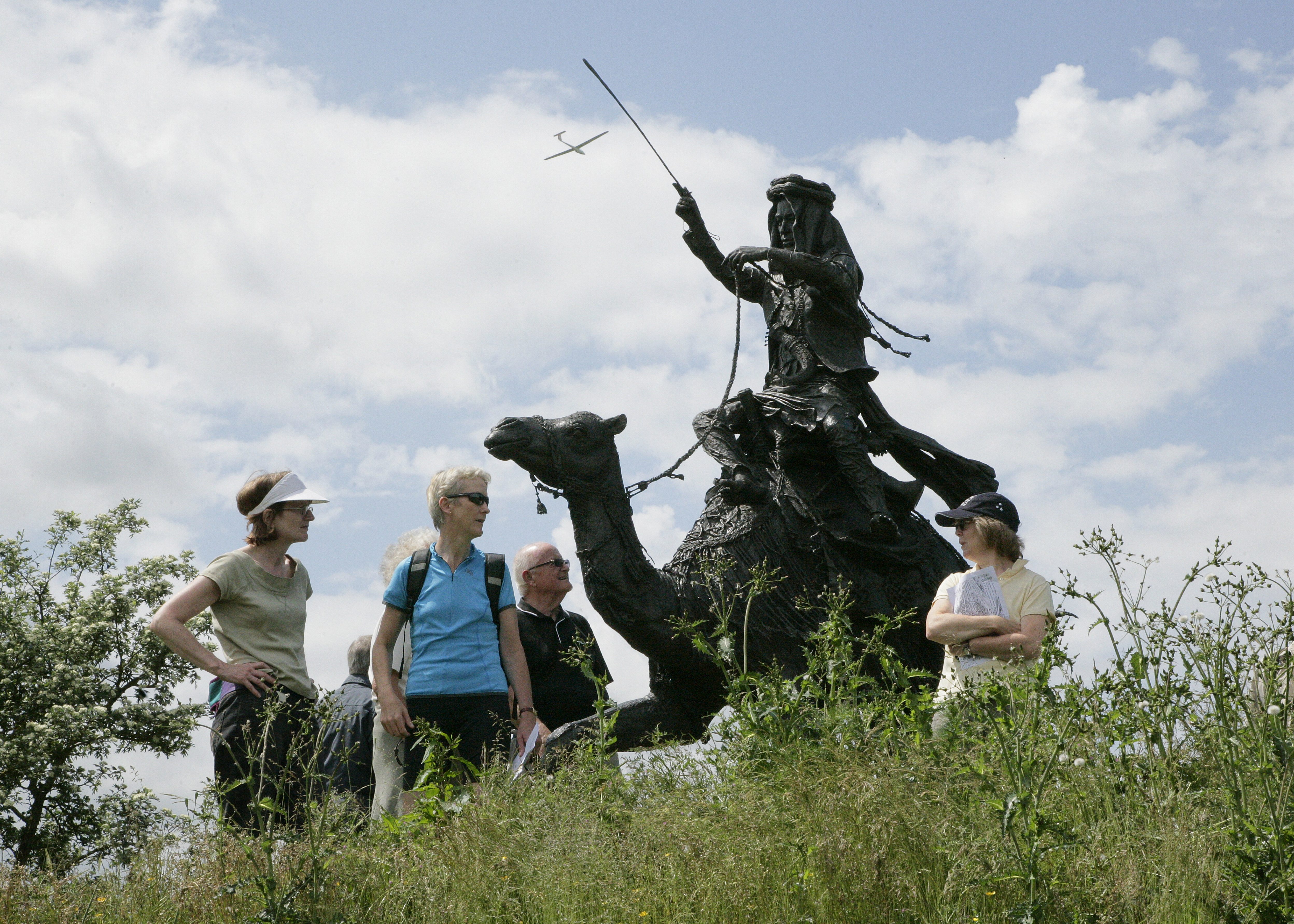 Visitors admiring the sculpture of Lawrence of Arabia