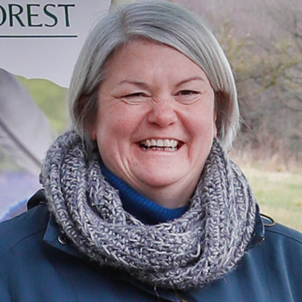 A close-up of Helen smiling at an event in the Forest