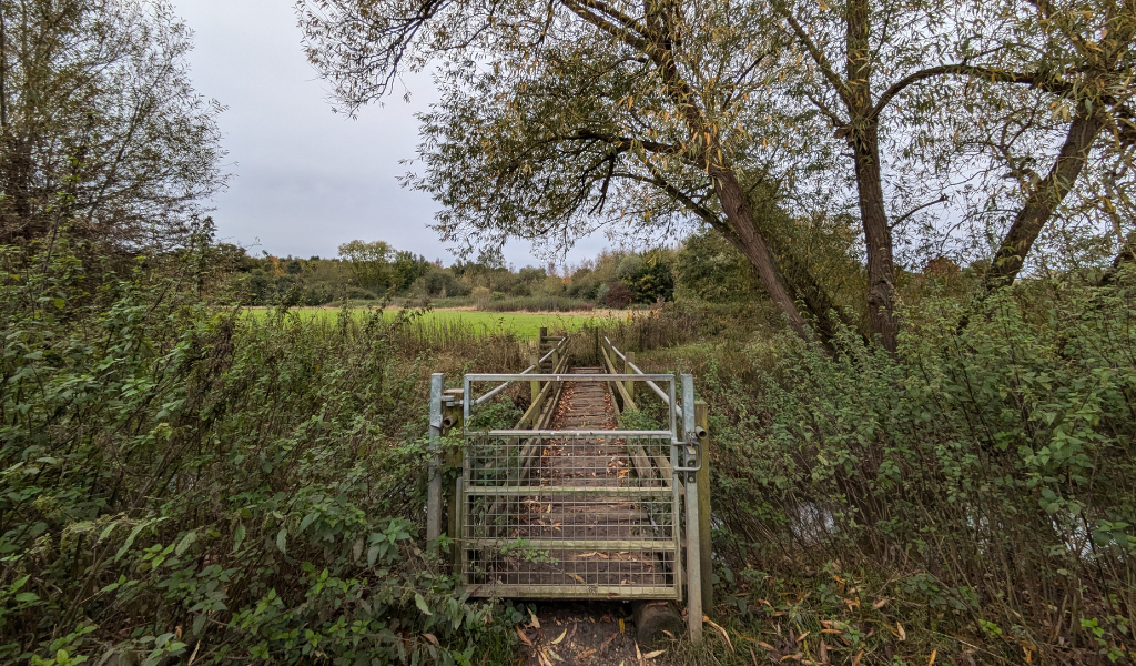 The last gate on the walk leading back to Dorothy's Wood car park, it's a bridge leading over Noleham brook