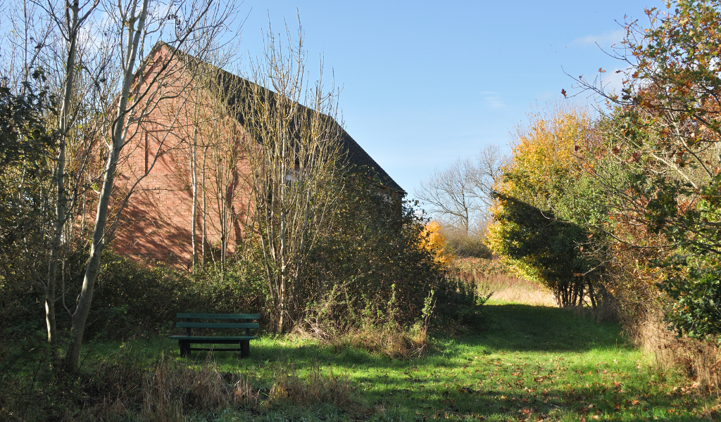 One of the barns in Gidding's Wood during autumn