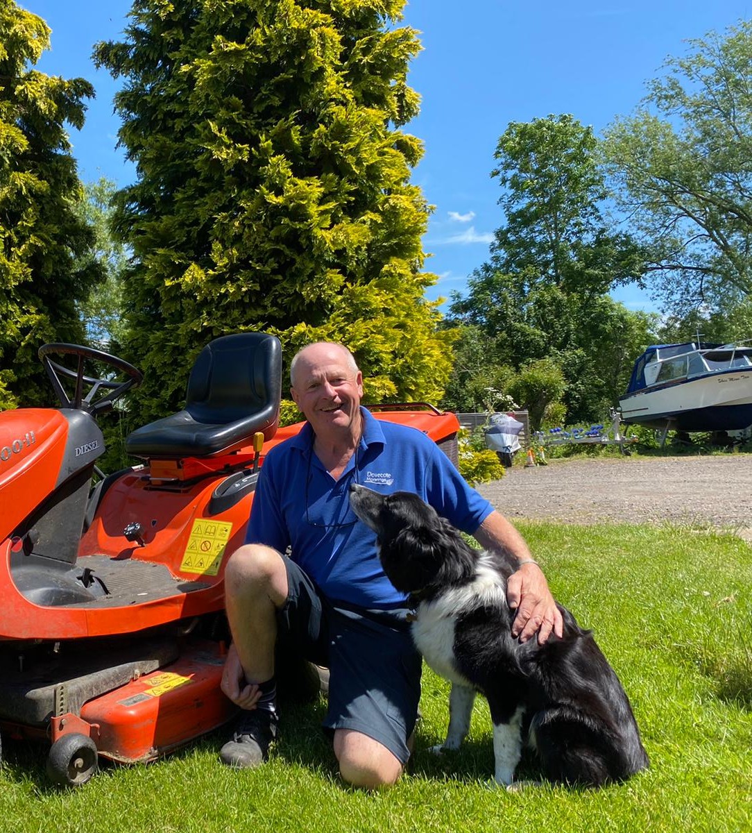 Mark and his dog Charlie on a sunny day in the Moorings and Caravan Park 