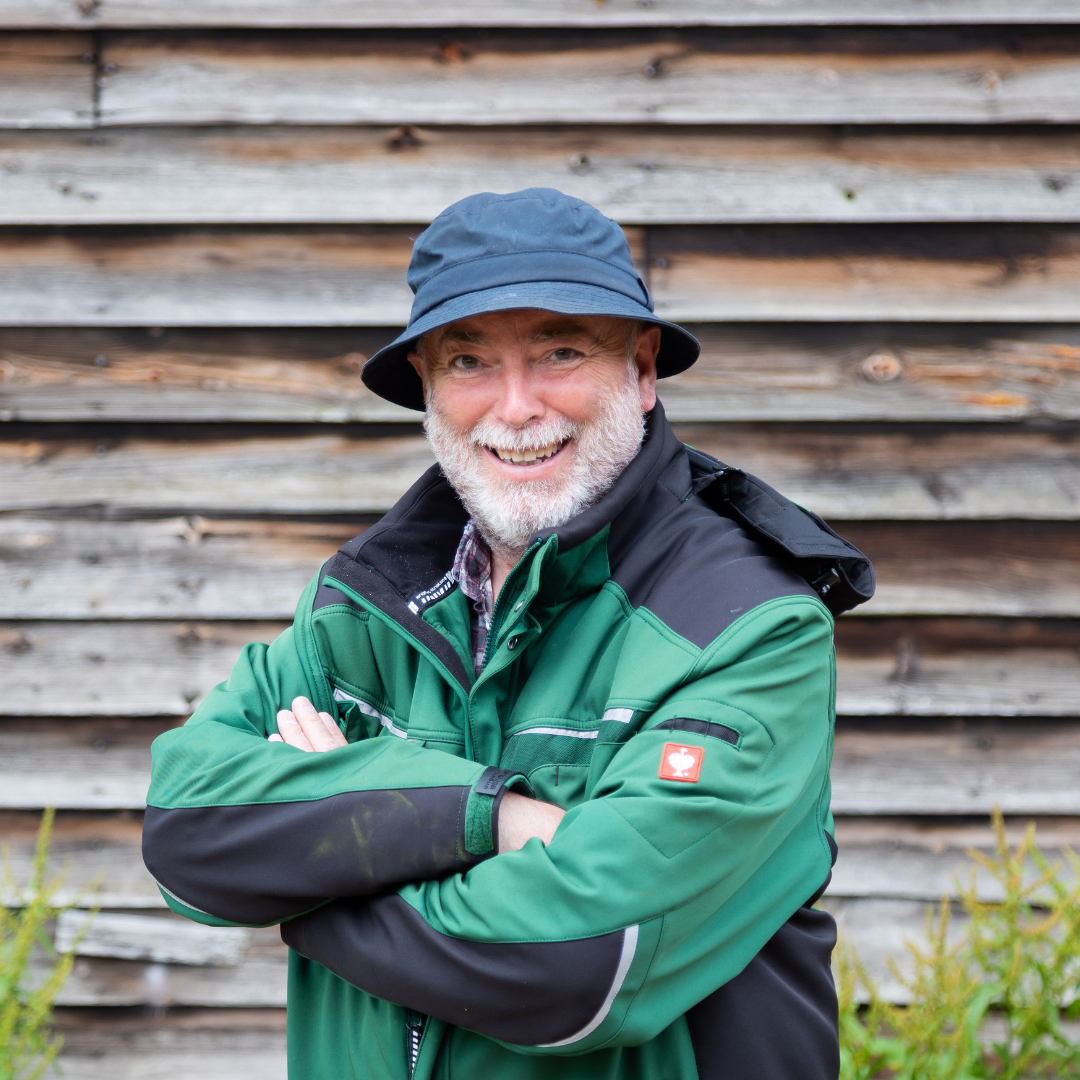 A photograph of Phil Stickley, Senior Outdoor Teacher smiling at the camera