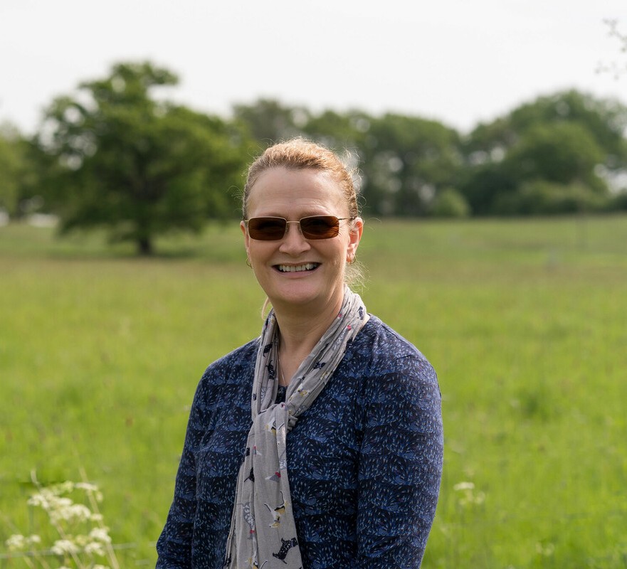 A headshot of Sarah Vance smiling at the camera 