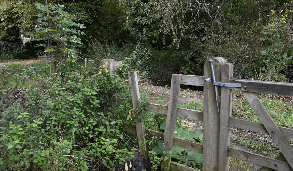 A concrete bridge over Noleham Brook, following the Founder's Walk route