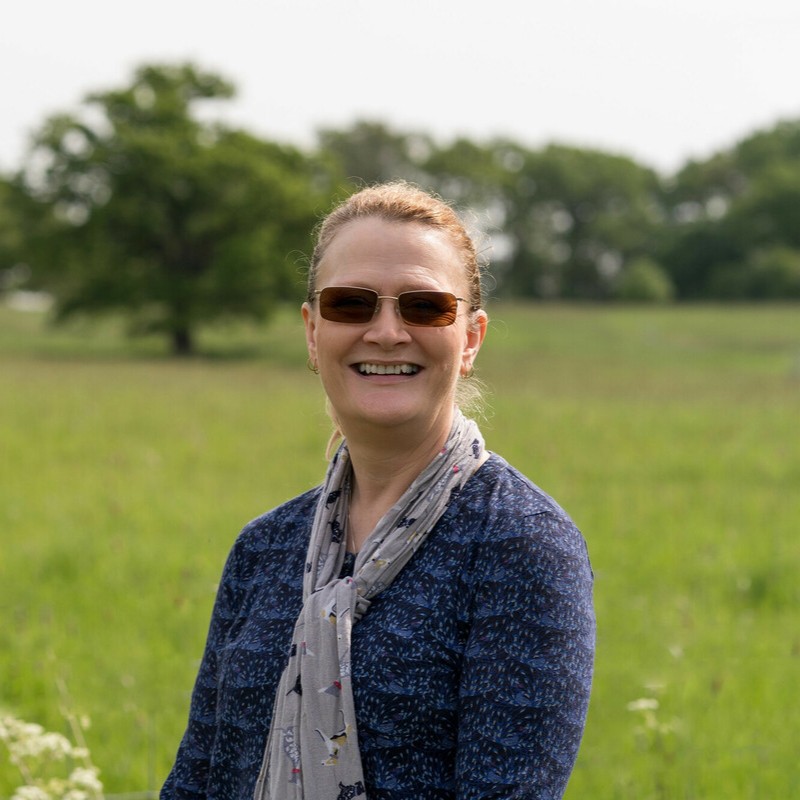 Sarah Vance smiling at the camera wearing sun glasses