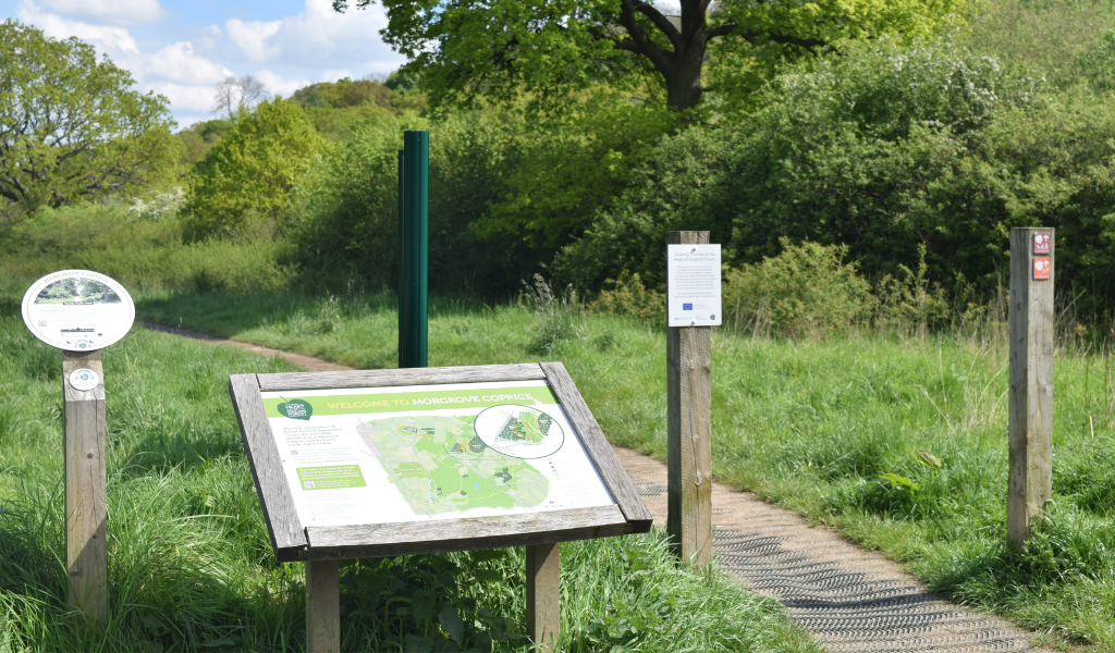 The informational boards at the beginning of the walk at the edge of the car park