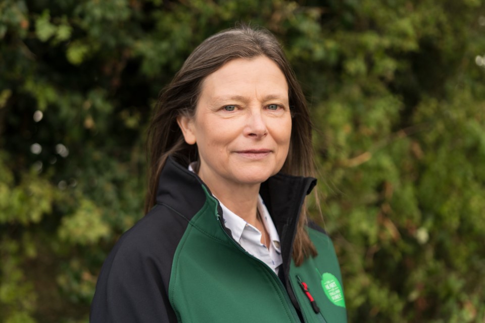 A picture of Ros Frisher smiling for the camera. October 2024