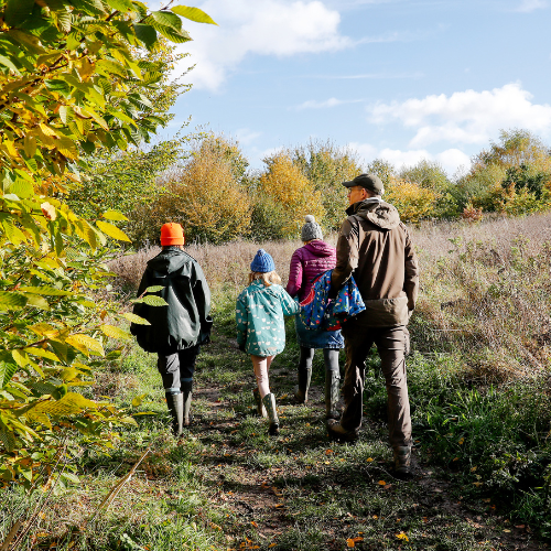 A family enjoying a walk through Dorothy's Wood.