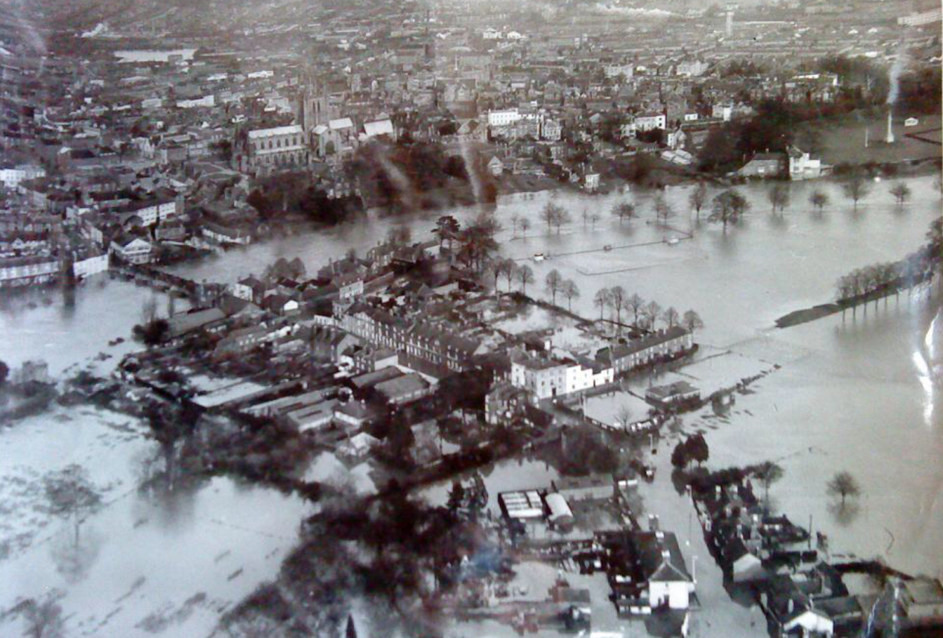 Aerial black and white photo showing flooding of buildings in Hereford centre