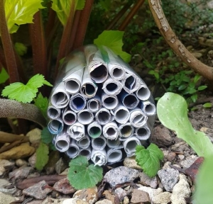 A homemade bug hotel placed out in nature