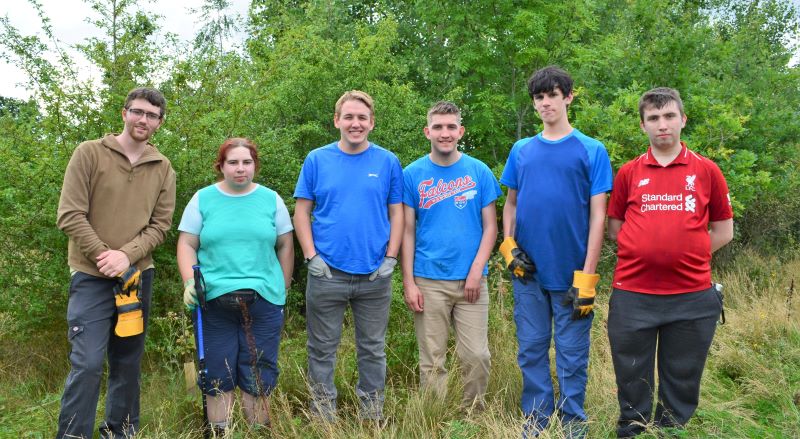 Group photo of our six supported interns standing in the Forest