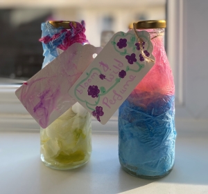 Two decorated bottles of homemade petal perfume