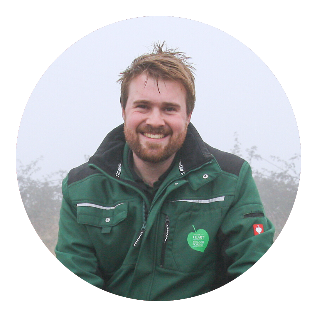 Jonathan Saunders head shot, smiling at the camera on a cold winters day