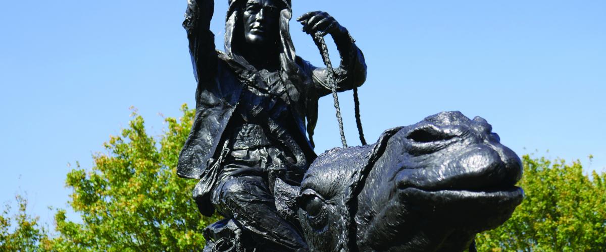 Close up of bronze statue of Lawrence of Arabia riding a camel 