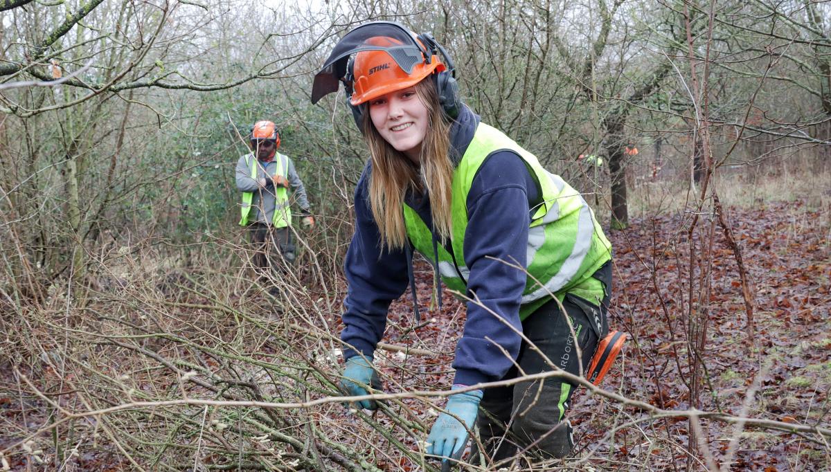 Forestry Apprentice Daisy working in the Forest wearing protective clothing