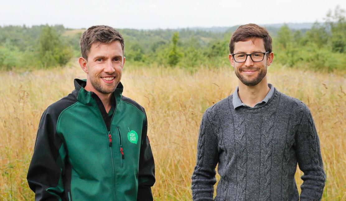 Racing driver and Forest Ambassador Alexander Sims and Forestry Intern Tim standing next to each other in the Forest