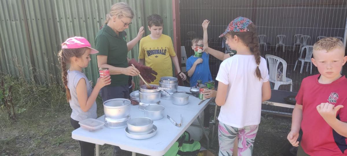 Andrea serving food during the holiday activities and food programme at Gorcott Hill
