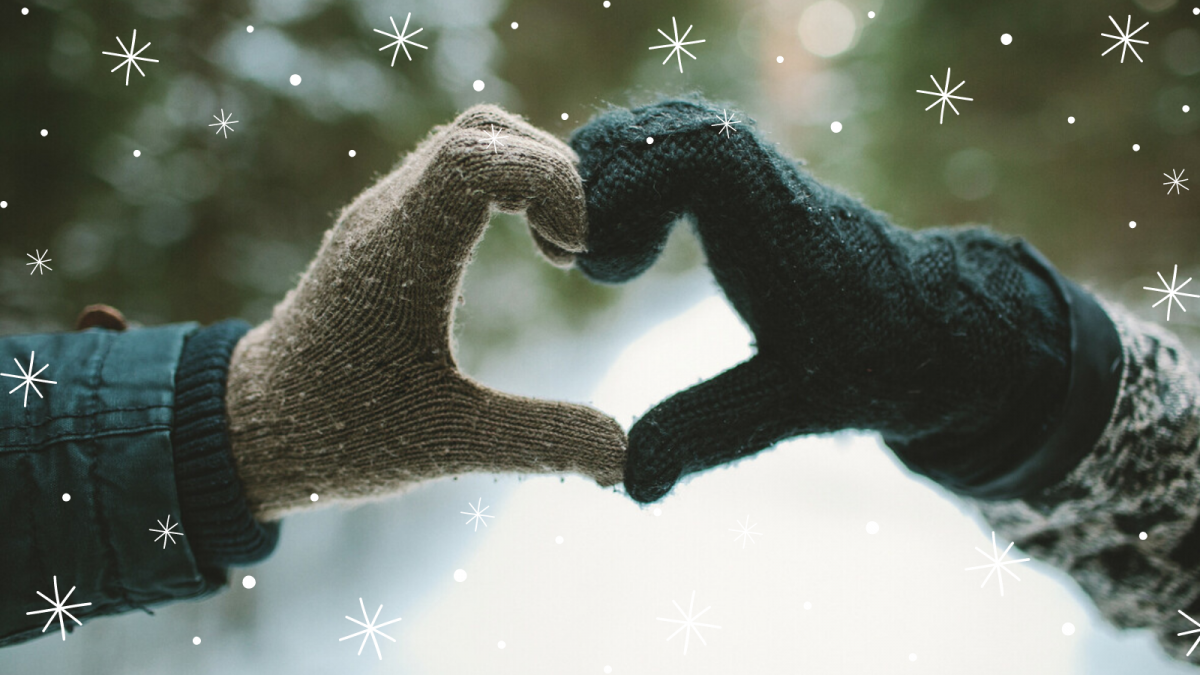 two gloved hands held together to make a heart shape