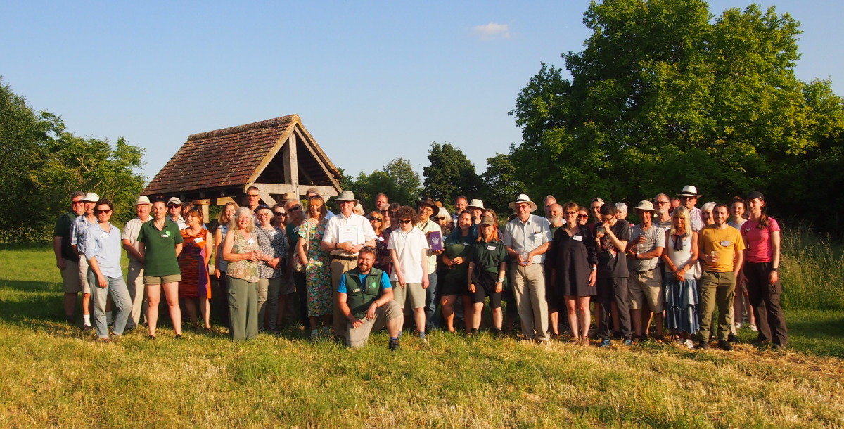 A group shot of our volunteers celebrating their Queens Award for voluntary service at the thank you event this summer.