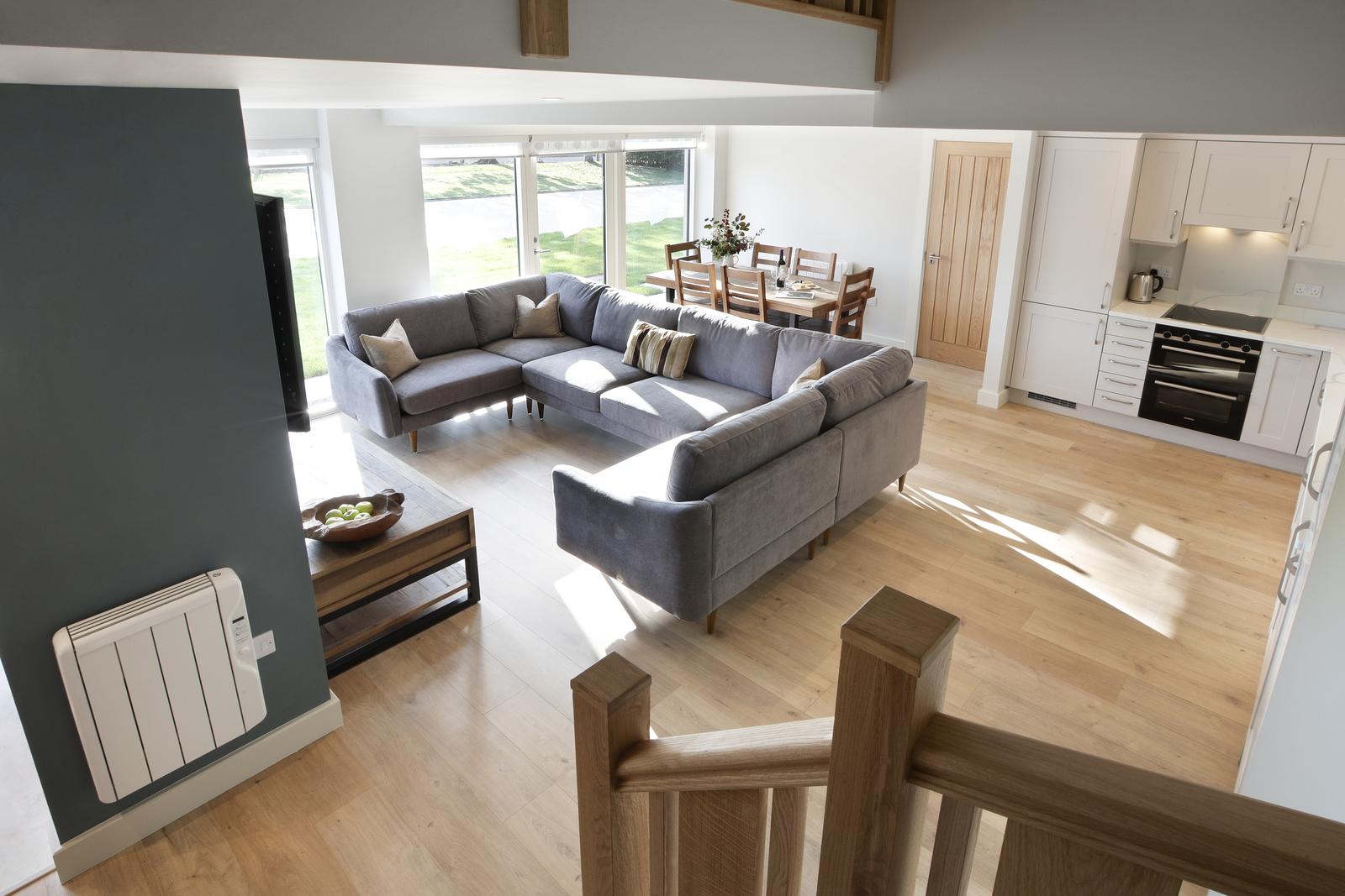 Photo of the open plan living space in Oak Cottage, one of the eco-friendly holiday cottages in the Forest