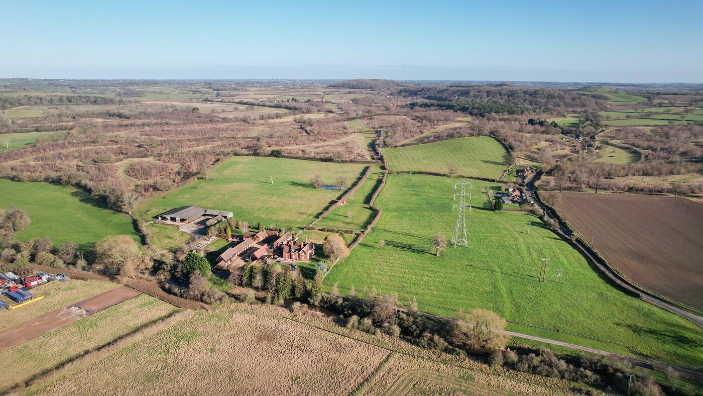 Aerial view of buildings and fields at Spernal Hall Farm