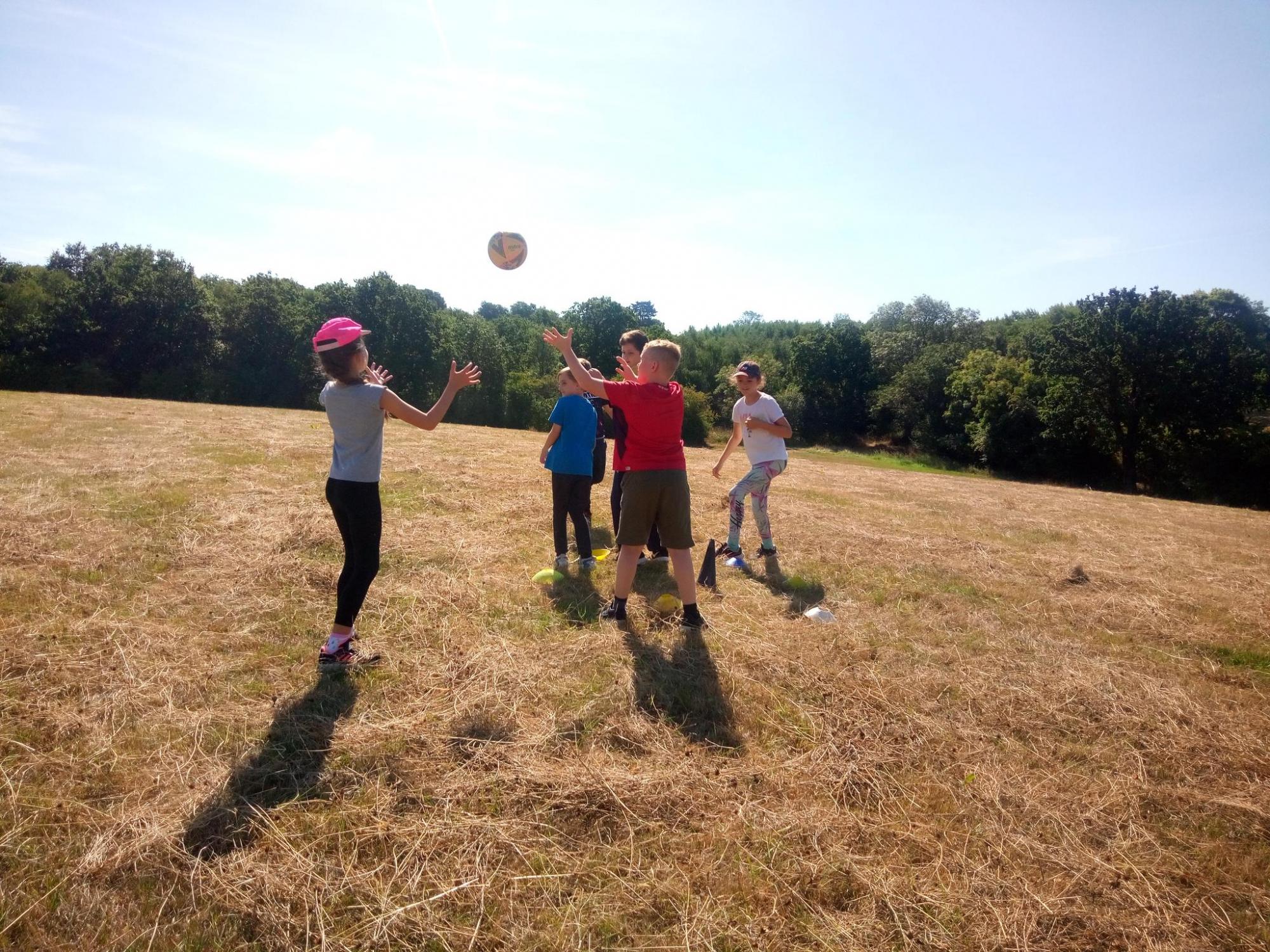 Children playing outside at Gorcott Hill with a ball