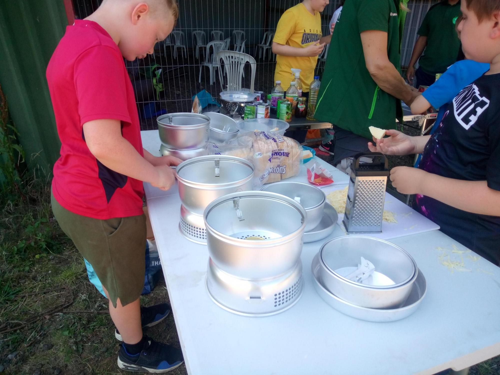 Children from the holiday activity and food programme helping prepare the meal