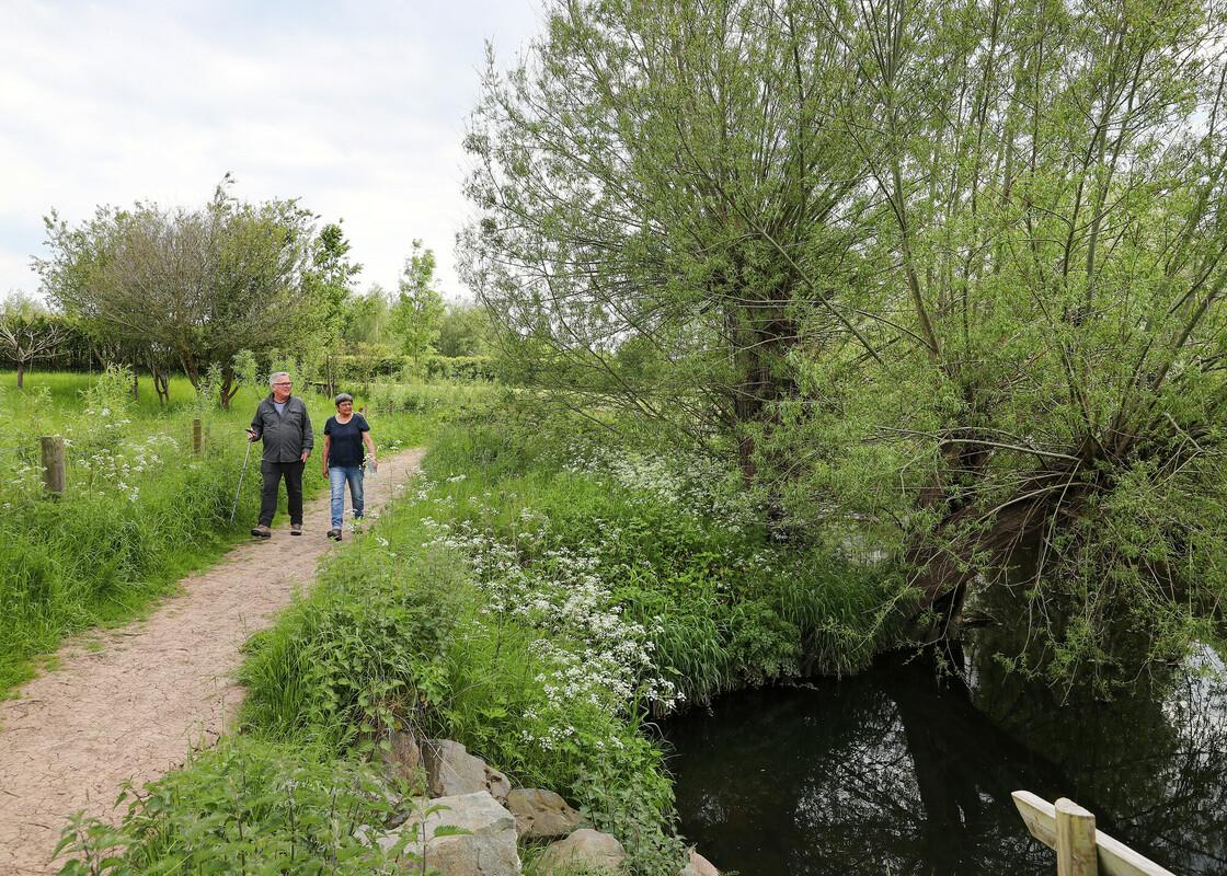 Forest visitors - Tom and Vishva walking along a footpath by water in Middle Spernal