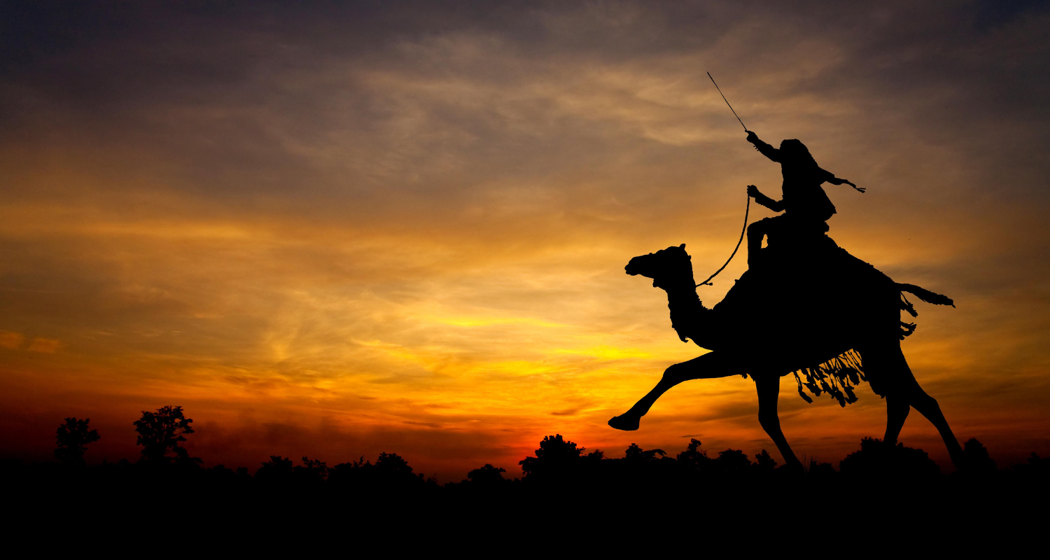 A statue at the Garden of Heroes and Villains at sunset