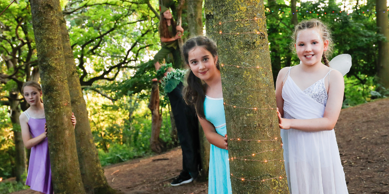 Children doing a Shakespeare performance in the Forest at Middle Spernal.