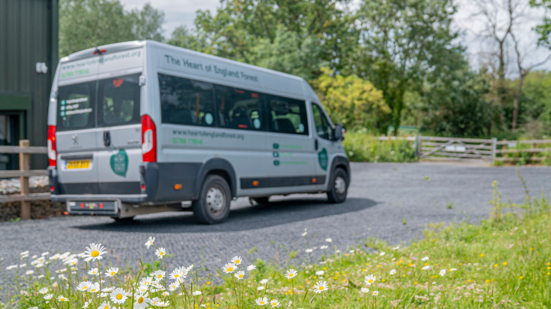 Minibus with flowers in the foreground
