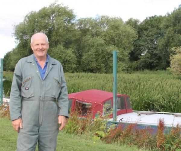 Mark, our mooring and caravan park manager, pictured standing by our moorings at Dovecote