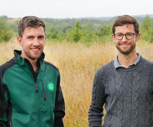 Racing driver and Forest Ambassador Alexander Sims and Forestry Intern Tim standing next to each other in the Forest