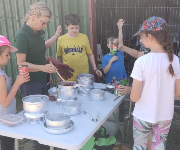 Andrea serving food during the holiday activities and food programme at Gorcott Hill