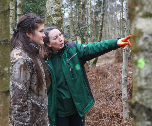 Elly, Outdoor Learning Officer and supported volunteer Lucy in the Gorcott Hill woods