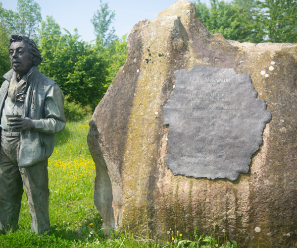 The Felix Dennis statue and Founder's Rock on the Founder's Walk.