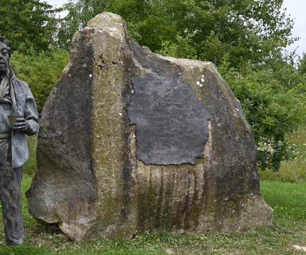 The Felix Dennis statue and Founder's Rock on the Founder's Walk.