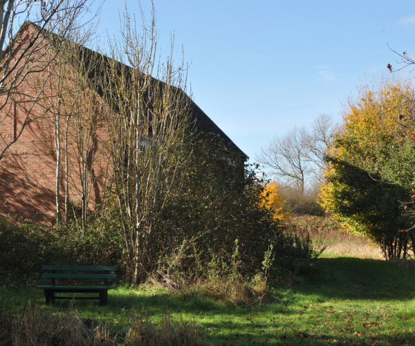 One of the barns in Gidding's Wood during autumn