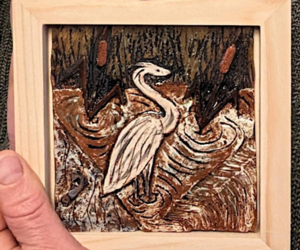 A ceramic tile made in one of Dave's pottery groups