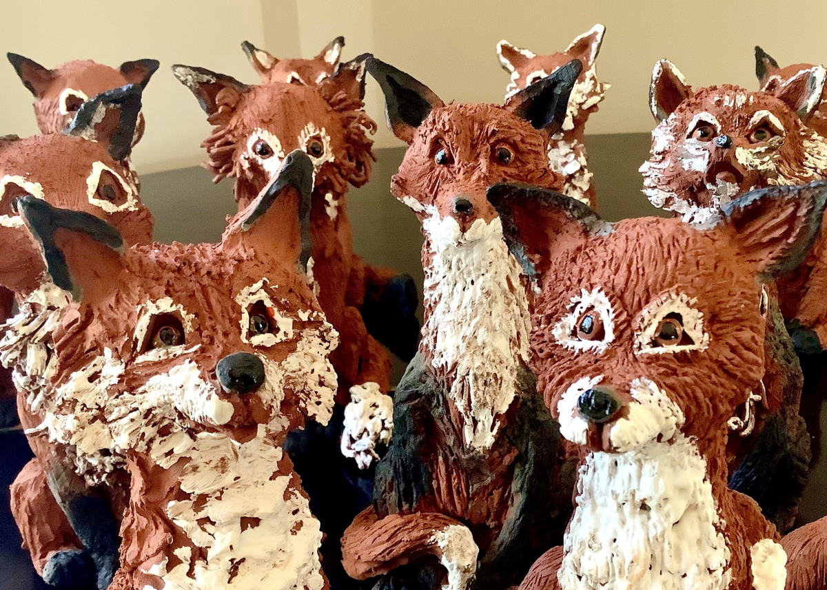 A group of ceramic foxes made at a workshop