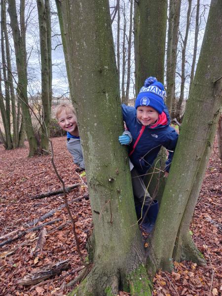 Two pupils pictured by a tree during an English lesson in the Forest 