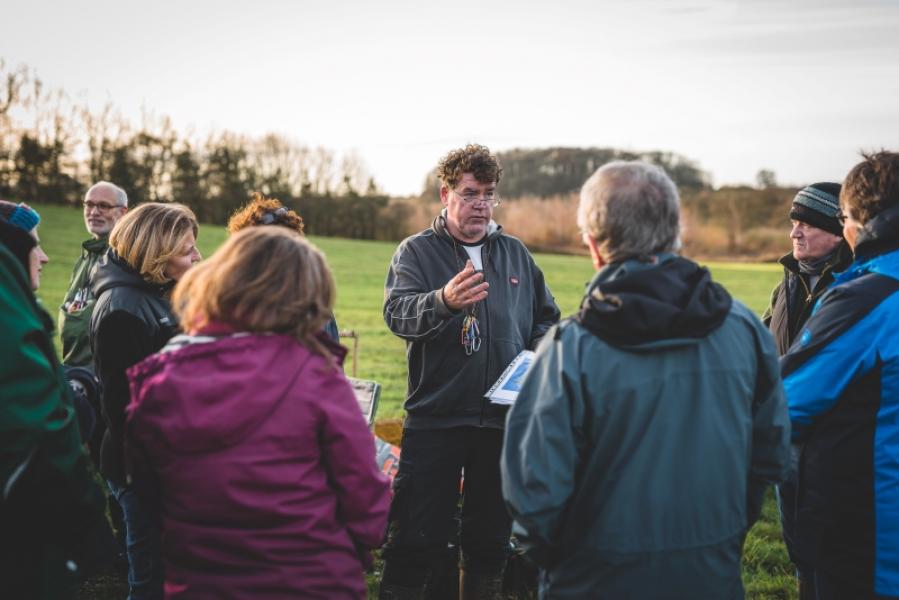 Tony Kelly leading a bird ringing group in the Forest