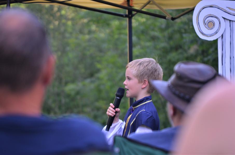 Pupil Josh speaking into a microphone whilst performing