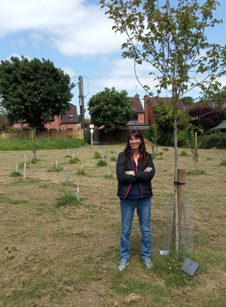 Kyla from the Great Alne Parish Council standing next to a tree