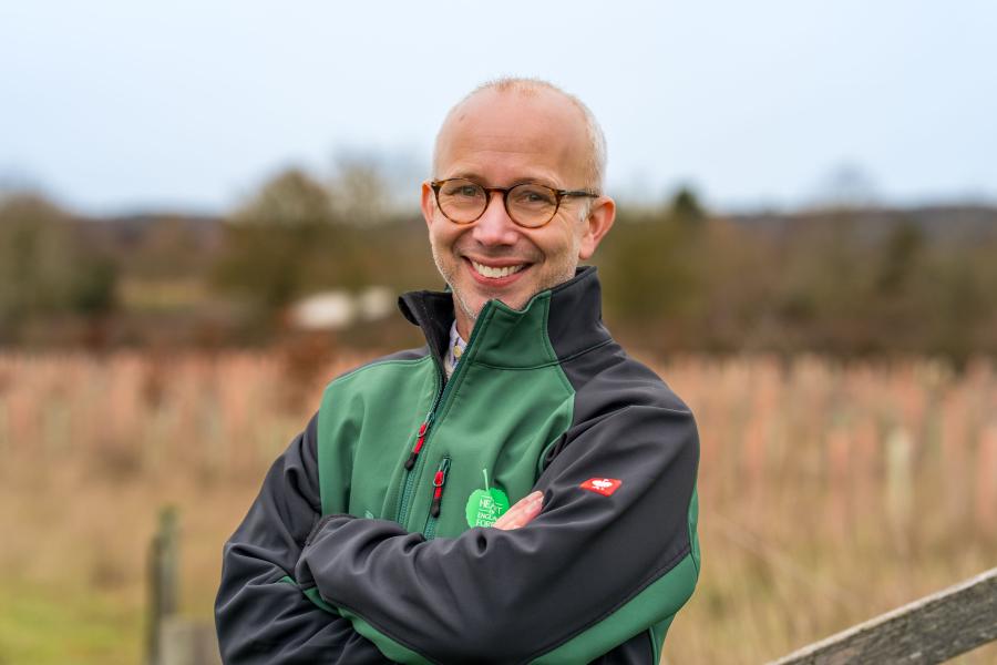 Ian Nutt, smiling with his arms crossed