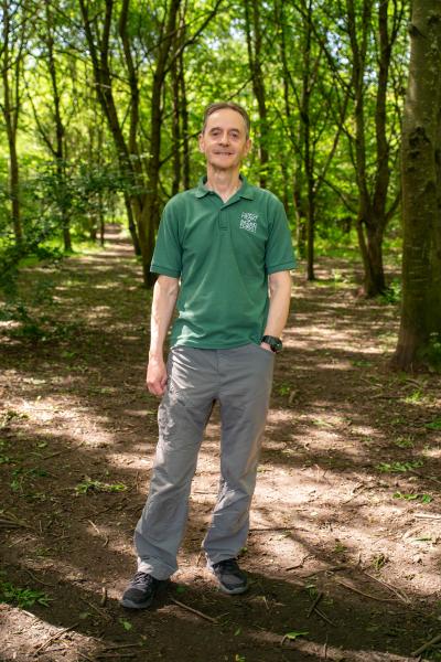 Paul Hirons standing in the woodland
