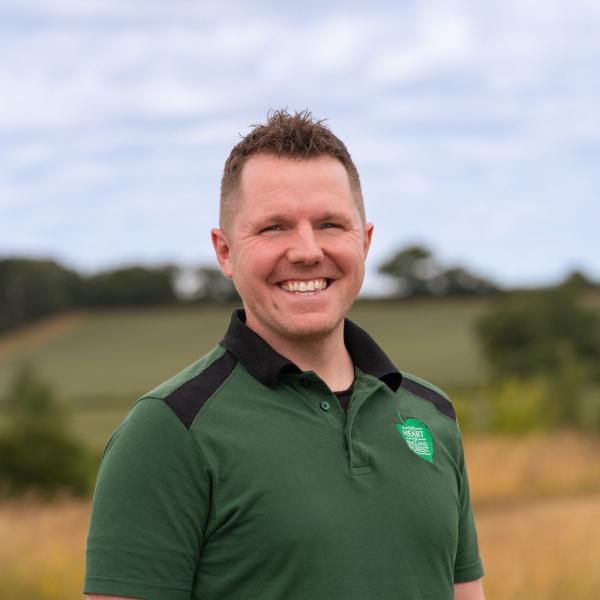Head and shoulders shot of Ben Toney, Access and Volunteer, wearing a branded top