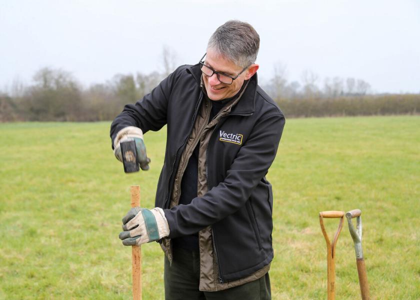 Edward Powell, Managing Director of Vectric Ltd hammering in a wooden stake into the ground